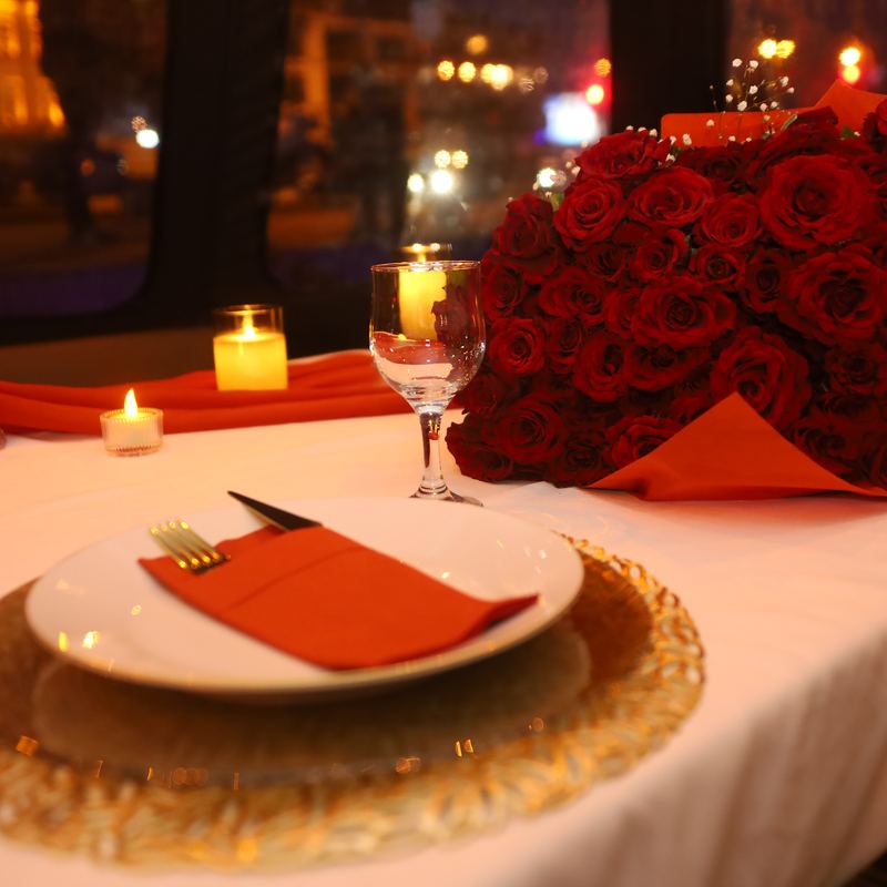Place setting with roses and candles